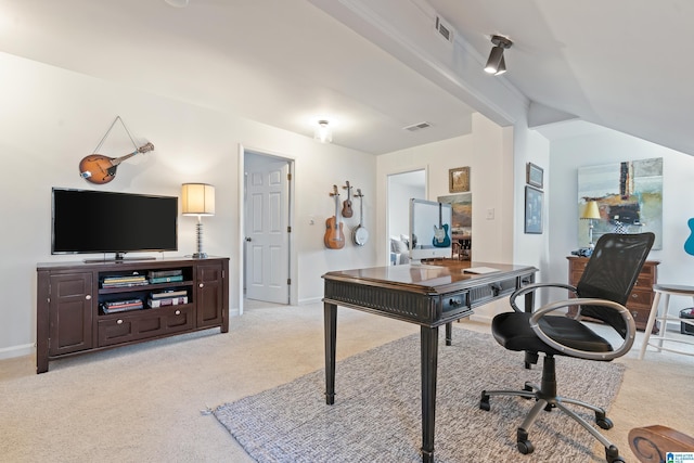 office area with visible vents, light carpet, and baseboards