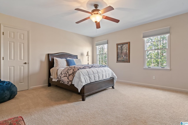 bedroom featuring a ceiling fan, baseboards, and carpet floors