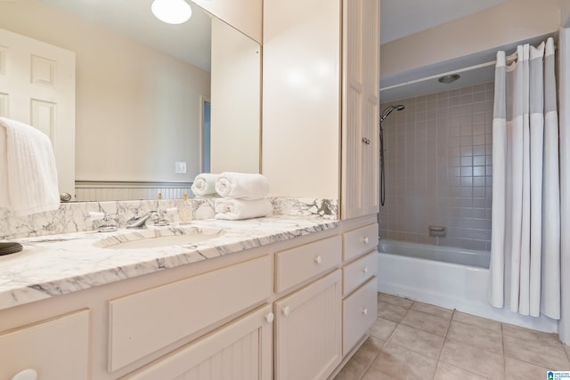 bathroom with tile patterned floors, vanity, and shower / bathtub combination with curtain