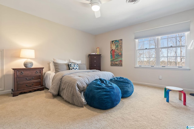 bedroom with visible vents, baseboards, carpet, and ceiling fan