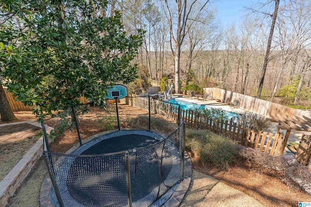 view of pool featuring a fenced in pool, a water slide, a patio, and fence