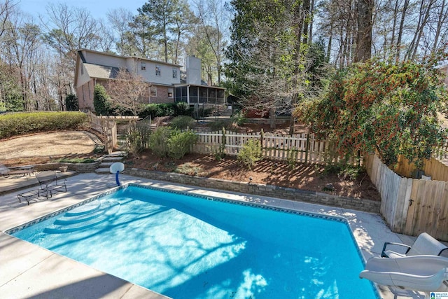 view of swimming pool with a patio, a fenced in pool, a sunroom, and fence private yard