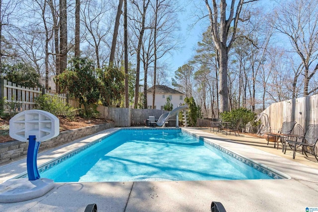 view of pool with a fenced in pool, a patio, and a fenced backyard