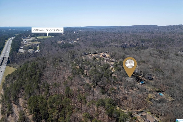 aerial view featuring a view of trees