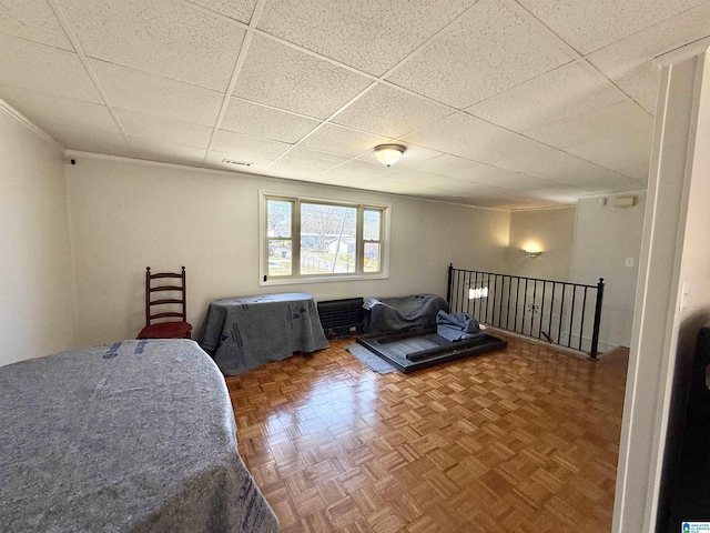 bedroom with a drop ceiling