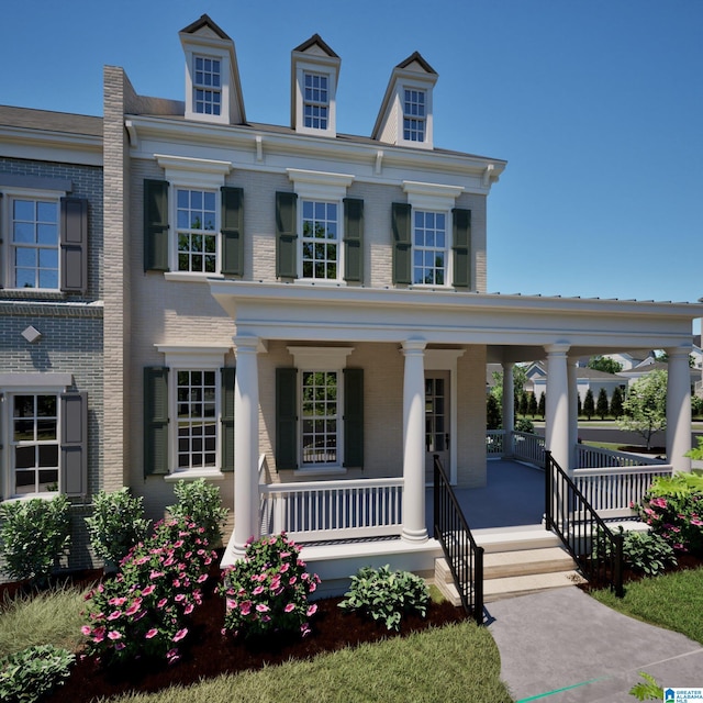 view of front of house with covered porch and brick siding