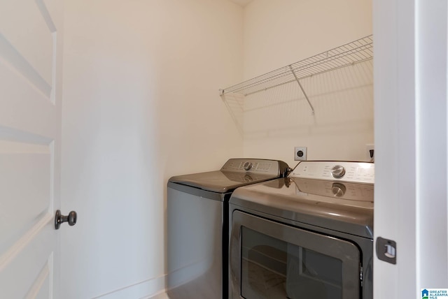 laundry room featuring laundry area and washing machine and clothes dryer