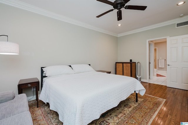 bedroom with recessed lighting, visible vents, hardwood / wood-style floors, and ornamental molding