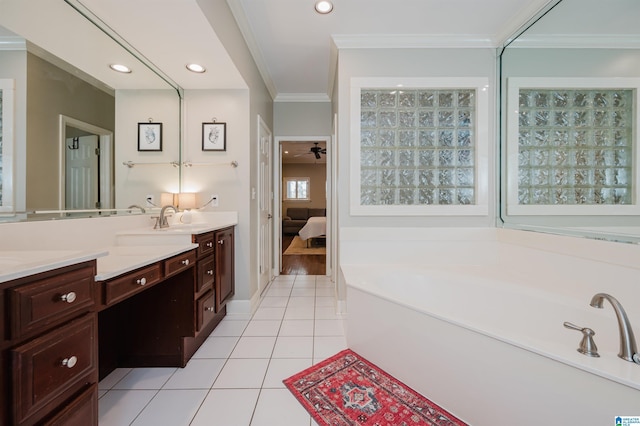 ensuite bathroom with recessed lighting, crown molding, tile patterned flooring, a bath, and vanity