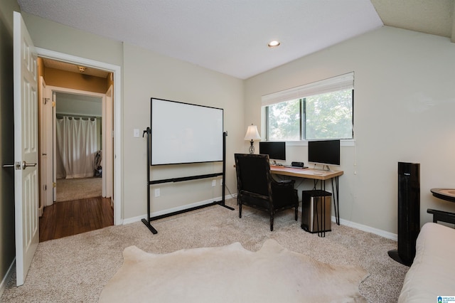 carpeted office with recessed lighting, baseboards, and lofted ceiling