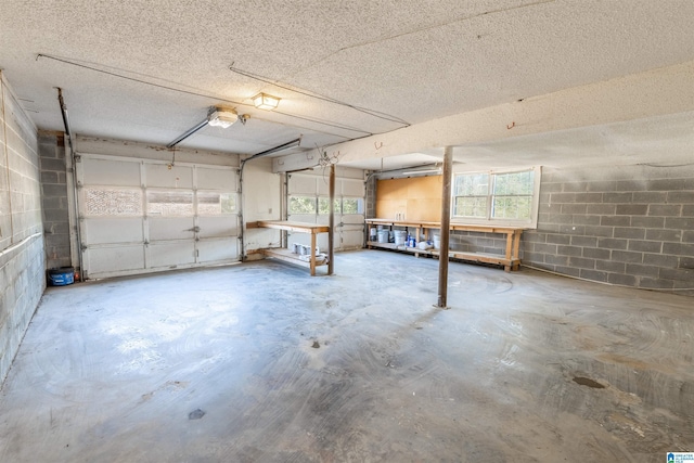 garage with concrete block wall