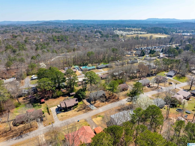 bird's eye view featuring a view of trees and a mountain view