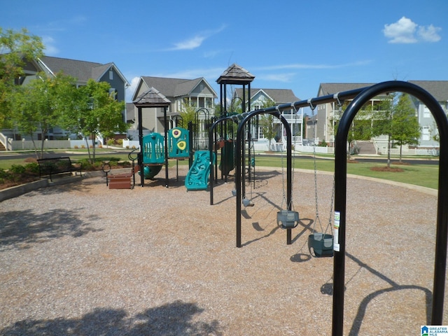 communal playground featuring a residential view