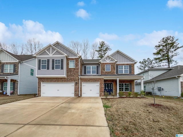 view of front facade featuring a garage, brick siding, board and batten siding, and driveway