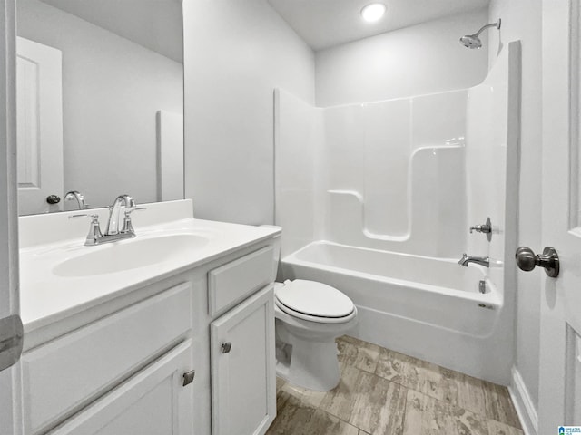 full bath with vanity, toilet, and shower / washtub combination