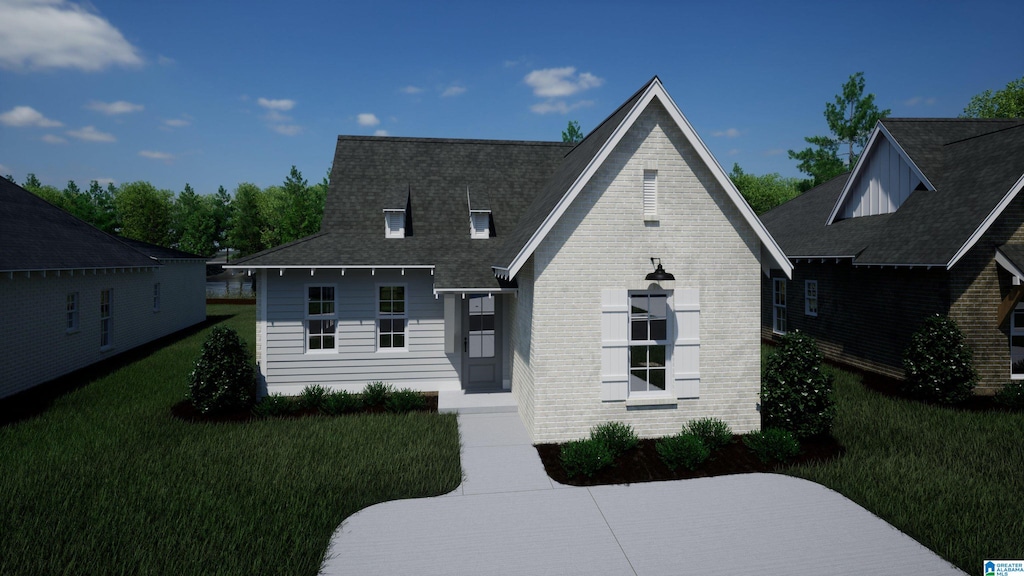 view of front of house featuring a front lawn and brick siding