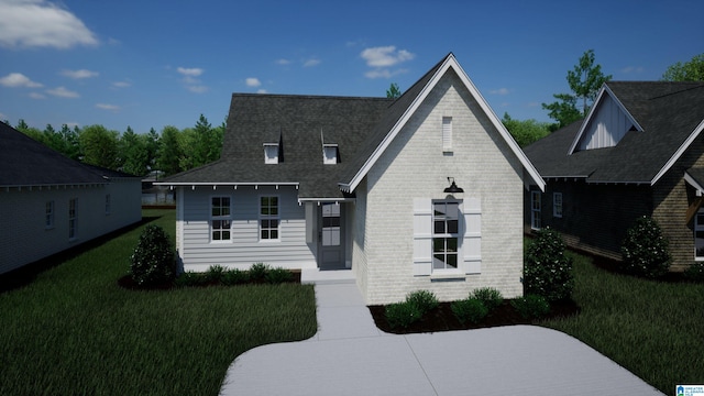 view of front of house featuring a front lawn and brick siding