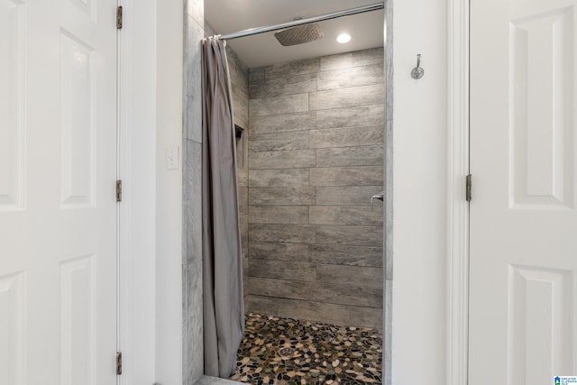 full bathroom featuring a stall shower