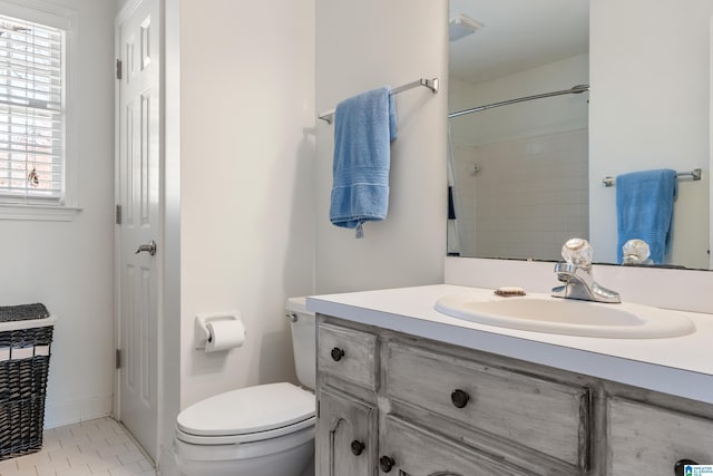 full bathroom featuring vanity, toilet, and tile patterned flooring