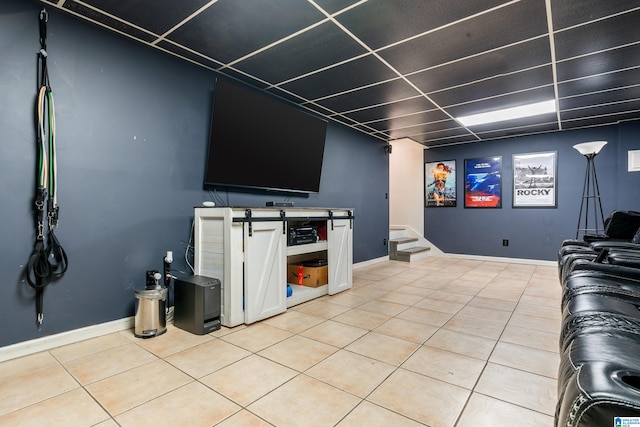 living area with stairway, light tile patterned floors, and baseboards