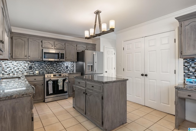 kitchen featuring a sink, tasteful backsplash, appliances with stainless steel finishes, crown molding, and light tile patterned floors