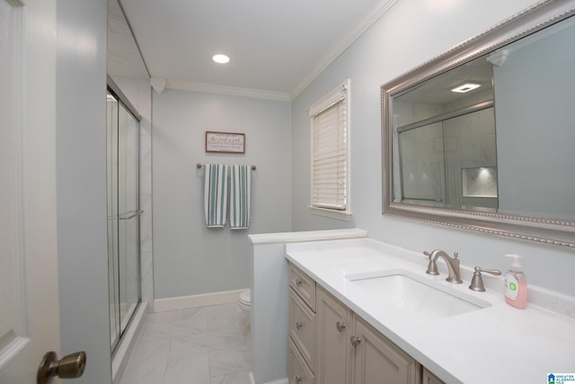 bathroom with a shower stall, toilet, crown molding, and marble finish floor