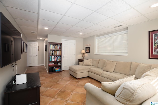 living room featuring light tile patterned floors, visible vents, recessed lighting, and a paneled ceiling