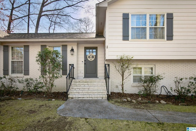 entrance to property with brick siding