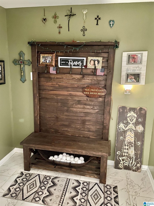 mudroom featuring baseboards and marble finish floor