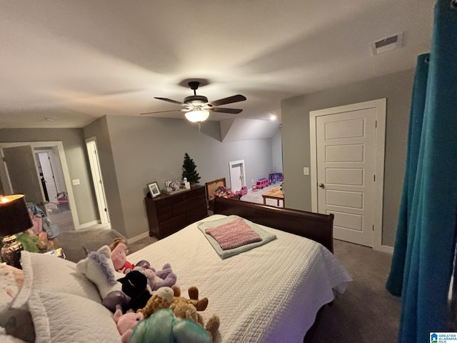 carpeted bedroom featuring visible vents, baseboards, and a ceiling fan