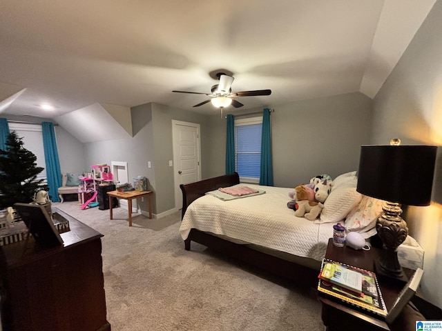 carpeted bedroom with baseboards, lofted ceiling, and ceiling fan