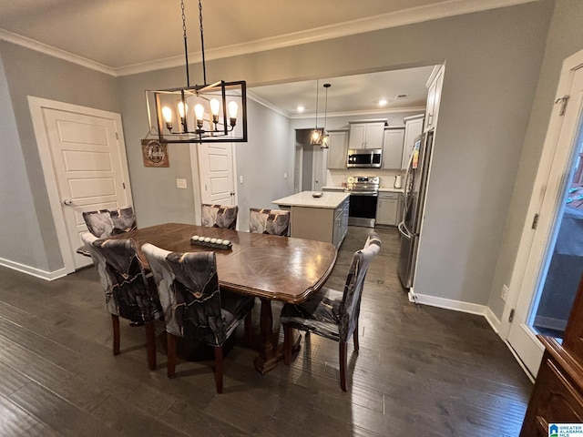 dining space with ornamental molding, dark wood-style floors, baseboards, and a chandelier