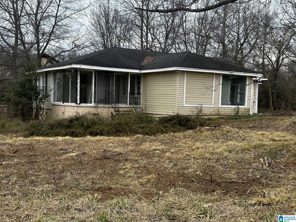 view of front of home featuring a sunroom