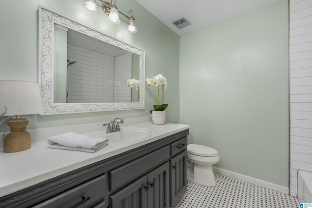 full bath with vanity, baseboards, visible vents, walk in shower, and toilet