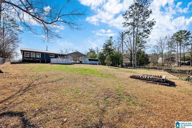 view of yard with a carport