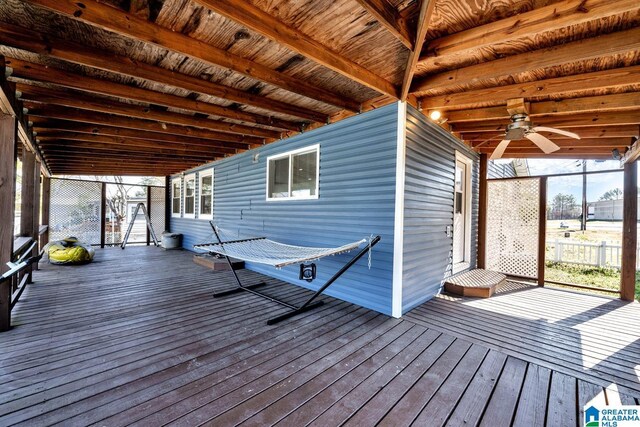 unfurnished sunroom featuring plenty of natural light and ceiling fan