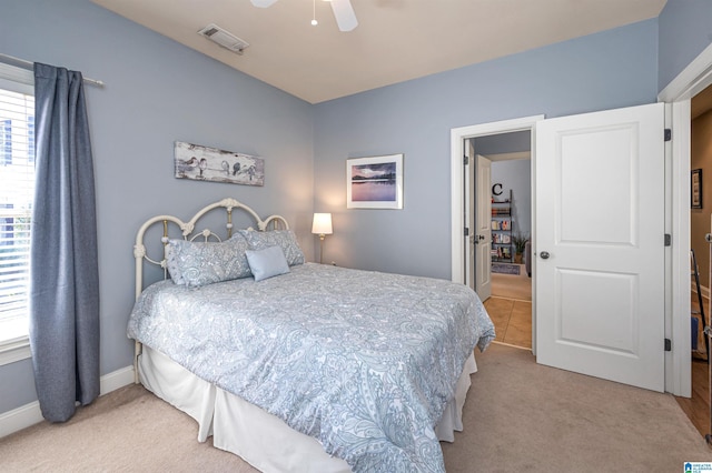 bedroom with carpet flooring, baseboards, visible vents, and a ceiling fan