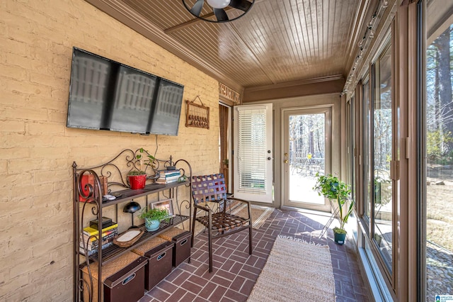 sunroom featuring wooden ceiling