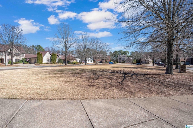 view of yard featuring a residential view