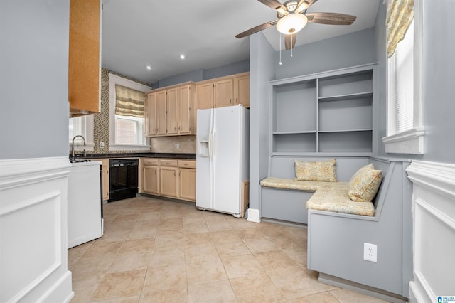 kitchen featuring black dishwasher, tasteful backsplash, white fridge with ice dispenser, and light brown cabinetry