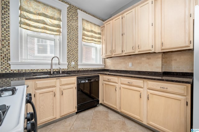 kitchen featuring white gas stove, a sink, black dishwasher, and light brown cabinetry