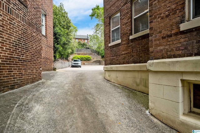 view of side of property featuring brick siding