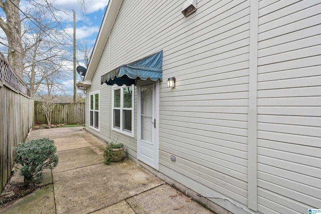 view of home's exterior featuring a fenced backyard and a patio area