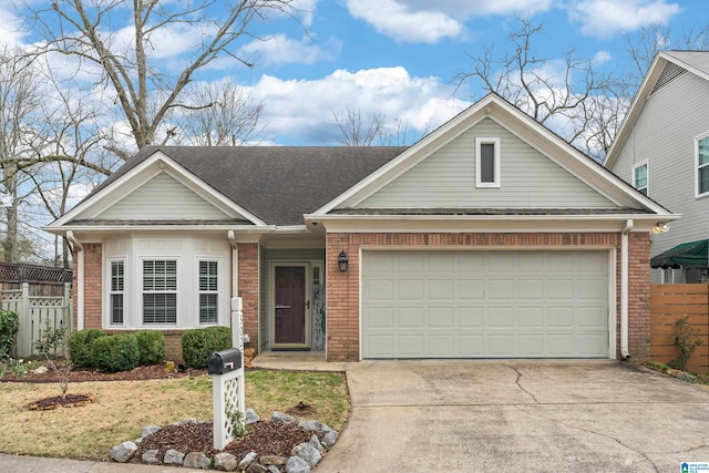 single story home with concrete driveway, an attached garage, fence, and brick siding