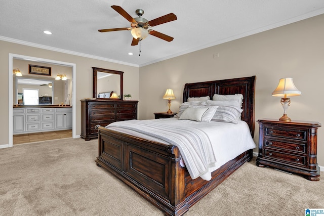 bedroom with recessed lighting, ceiling fan, crown molding, light colored carpet, and connected bathroom