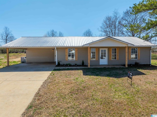 130 Alexandria Heights Cir, Alexandria, AL 36250 - single story home with metal roof, an attached carport, concrete driveway, and a front lawn