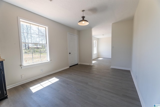 130 Alexandria Heights Cir, Alexandria, AL 36250 - unfurnished dining area featuring dark wood-type flooring and baseboards