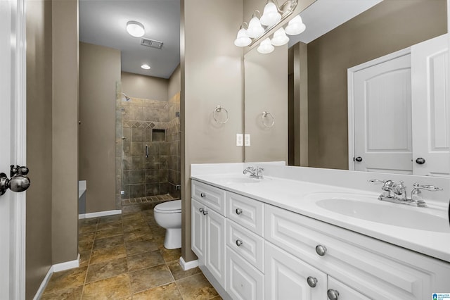 bathroom featuring a sink, visible vents, and a shower stall