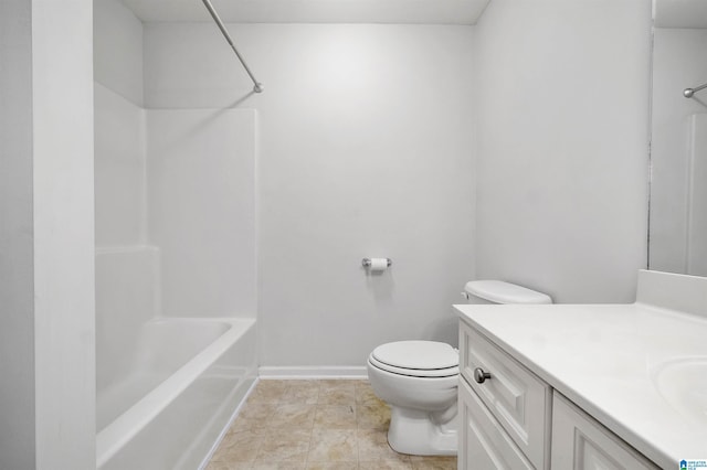 full bathroom featuring vanity, toilet, baseboards, and shower / washtub combination