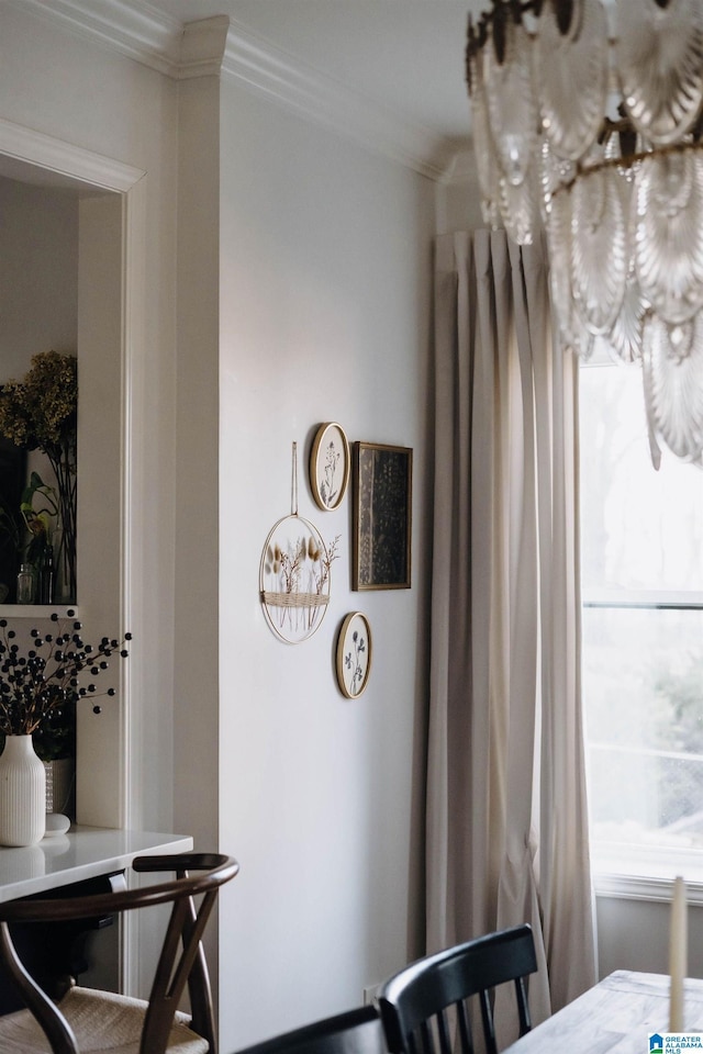dining area featuring crown molding